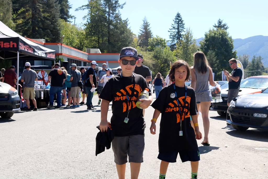 Titus Wilhelm, 9, and Isaih Lee-Akre, 8, enjoyed a sunny day &ldquo;looking at cool cars&rdquo; at DirtFish.                                (Evan Pappas/Staff Photo)