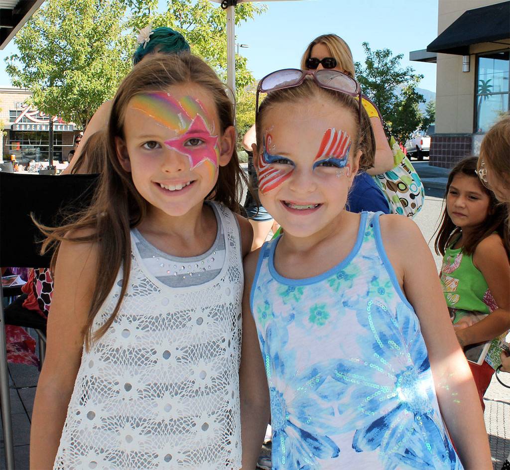 Girls show off their fancy face-paint at the Snoqualmie Valley Block Party. (Courtesy Photo)