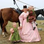 Sarah Silvia takes Trinity and Shelby to pet the horses. (Evan Pappas/Staff Photo)