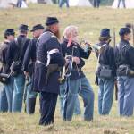 Two buglers stand behind the union soldiers to help guide the action with their short signals. (Evan Pappas/Staff Photo)