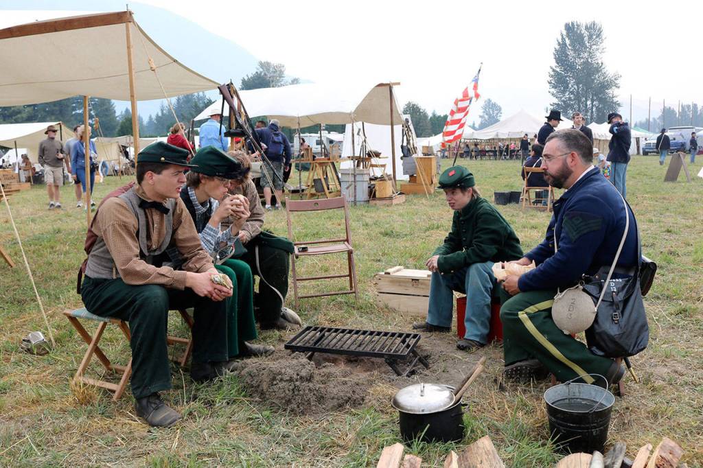 After a Civil War battle reenactment Saturday, Union soldiers head back to camp for a meal. (Evan Pappas/Staff Photo)