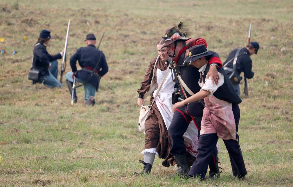 A &ldquo;wounded&rdquo; soldier is taken off of the battlefield by medics. (Evan Pappas/Staff Photo)