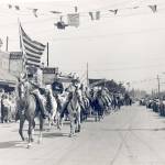 The Snoqualmie Valley Riding Club rides through Snoqualmie. (Photo Courtesy of the Snoqualmie Valley Historical Museum)