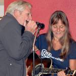 Heather B Blues gets harmonica backup from an audience member.