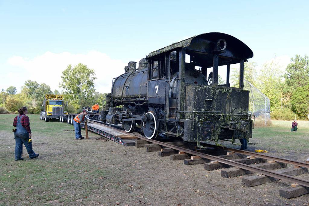 Northwest Railway Museum volunteers build a short track onto the bed of a hauling truck at Blodel-Donovan Park in Bellingham. (Photo courtesy of Northwest Railway Museum)