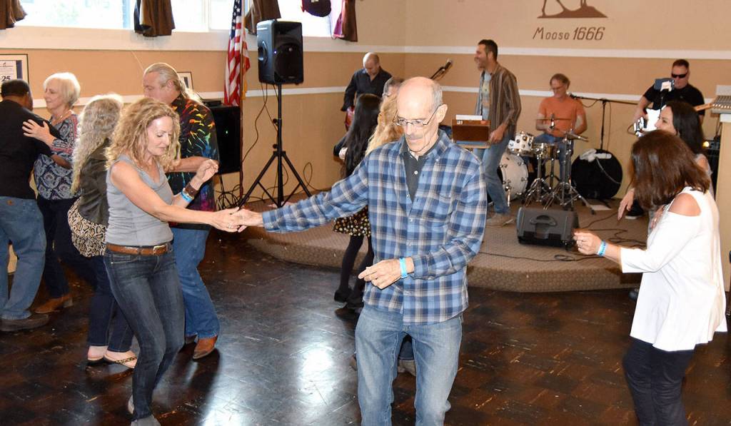 Dancers at the Moose Lodge take a turn to the sounds of The Tonic. (Carol Ladwig/Staff Photo)