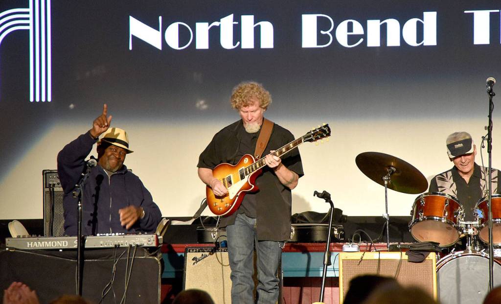 Red House closed out their set at North Bend Theatre with a nod to their appreciative crowd. (Carol Ladwig/Staff Photo)