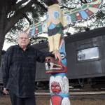 The memory of Snoqualmie city leader Charles Peterson, pictured here with the totem pole in downtown Snoqualmie, will be celebrated with a series of memorials unveiled in a dedication ceremony starting at 2 p.m., Sunday, Oct. 1, at Snoqualmie United Methodist Church. (File Photo)