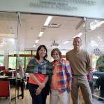 Julie, Carol and Ryan Peterson stand in front of the newly unveiled Snoqualmie City Council Chambers, dedicated to their husband and father, Charles S. Peterson. (Evan Pappas/Staff Photo)