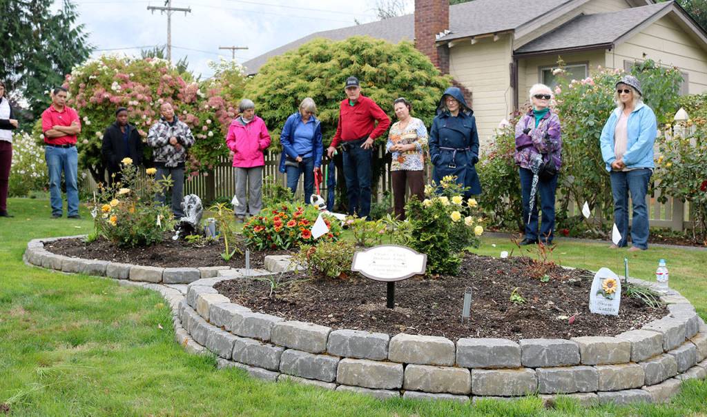 One stop on the dedication tour was this memorial garden, created by Carol Peterson outside her Snoqualmie home. (Evan Pappas/Staff Photo)