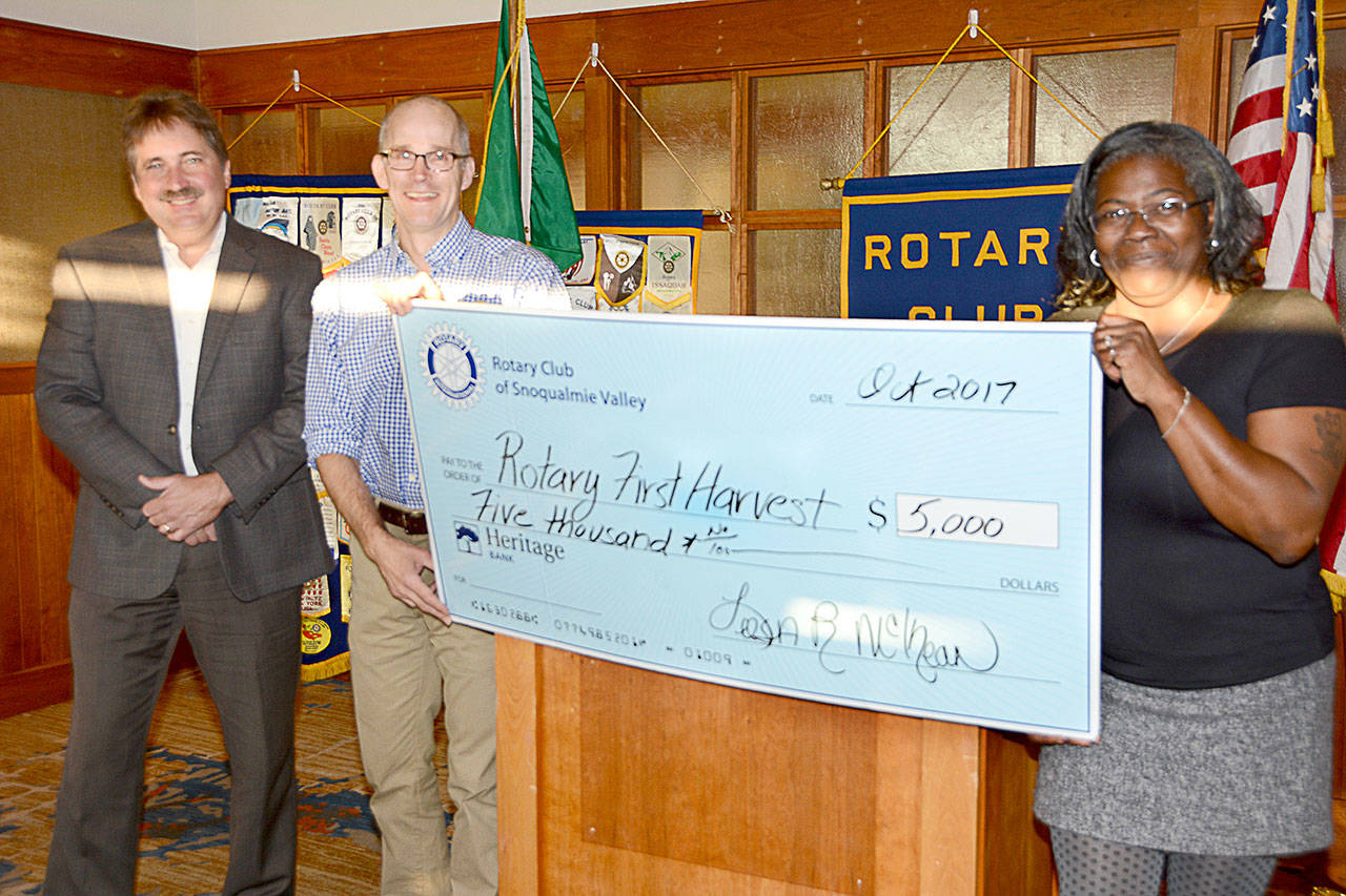 Presenting a $5,000 donation to Rotary First Harvest&rsquo;s David Bobanick, center, are Rotarian Steve Weaver, left, and Rotary President Leesa McKay. (Courtesy Photo)