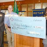 Presenting a $5,000 donation to Rotary First Harvest&rsquo;s David Bobanick, center, are Rotarian Steve Weaver, left, and Rotary President Leesa McKay. (Courtesy Photo)