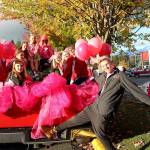 Members of the Mount Si High School cross country team pose for a photo before the start of the Homecoming parade Friday afternoon. (Carol Ladwig/Staff Photo)