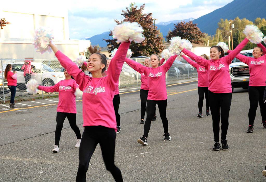 Dance team members march in the parade. (Carol Ladwig/Staff Photo)