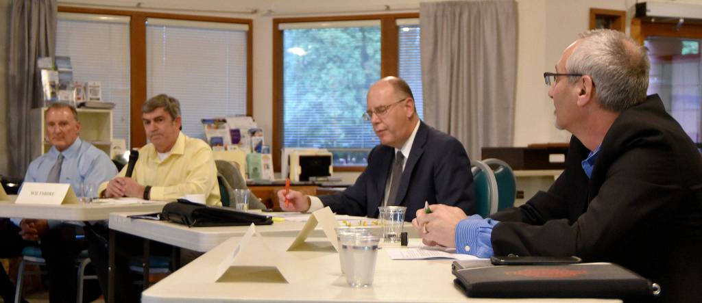 Candidates in North Bend City Council races assembled for a forum Oct. 18 at Mount Si Senior Center. Pictured from left are candidates Ross Loudenback and Rich Wiltshire, moderator William Shaw, and candidate Alan Gothelf. (Carol Ladwig/Staff Photo)