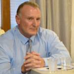 Ross Loudenback listens as his opponent answers a questionin the city at the Oct. 18 candidate forum sponsored by the Snoqualmie Valley Chamber of Commerce. (Carol Ladwig/Staff Photo)