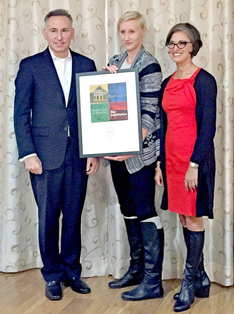 Diana Keller, center, received the Spellman Award for Rehabilitation from King County Executive Dow Constantine, left, and King County Historic Preservation OfficerJennifer Meisner. (King County photo by Ned Ahrens)