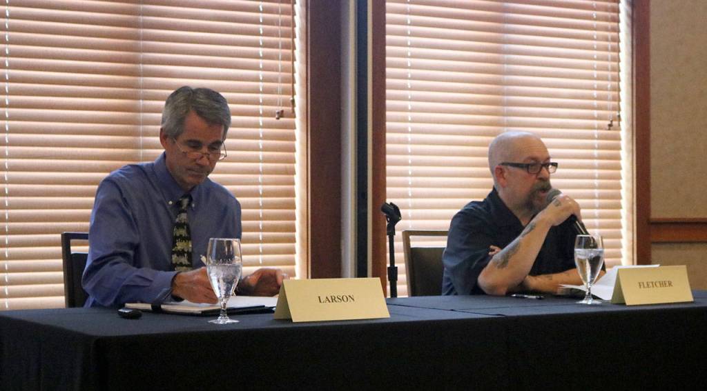 Incumbent Mayor Matt Larson, left, and challenger Fuzzy Fletcher answer various questions about their vision for the future of Snoqualmie at the Chamber&rsquo;s final candidate forum. (Evan Pappas/Staff Photo)