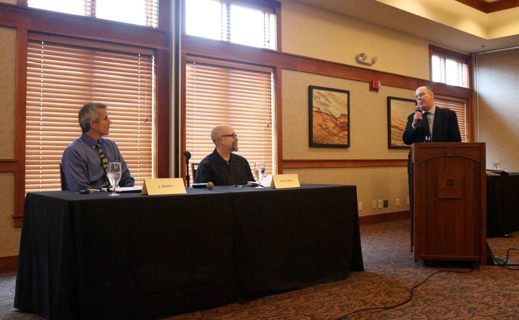 Moderator William Shaw introduces the candidates and asks them about the greatest risk to the continued success of the city. (Evan Pappas/Staff Photo)