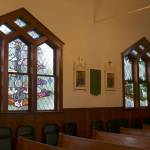 Two of the new stained glass windows inside St. Anthony Catholic Church. (Evan Pappas/Staff Photo)