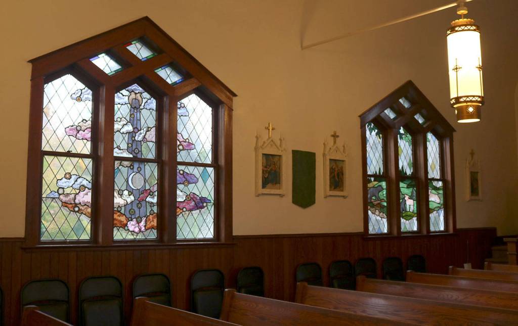Two of the new stained glass windows inside St. Anthony Catholic Church. (Evan Pappas/Staff Photo)