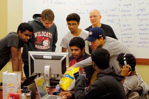 Students in the Siber Defense Club crowd around a computer to discuss how to solve a problem during the 2016 Capture the Flag competition. (Courtesy Photo)