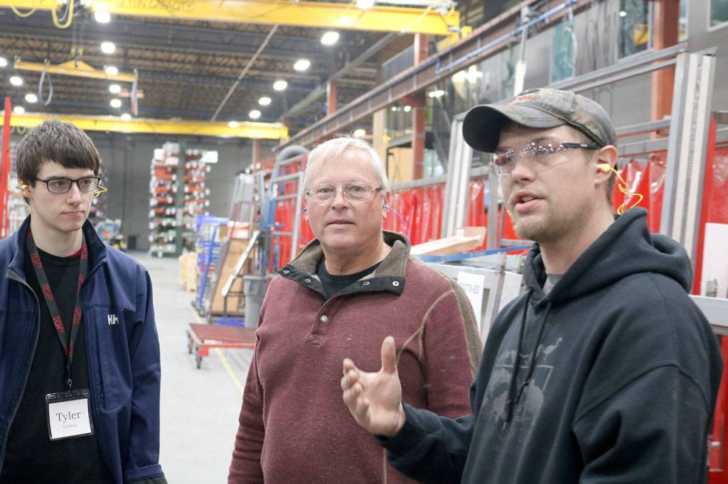 Daryl Petree explains his job to a student group taking a tour through the warehouse. (Evan Pappas/Staff Photo)