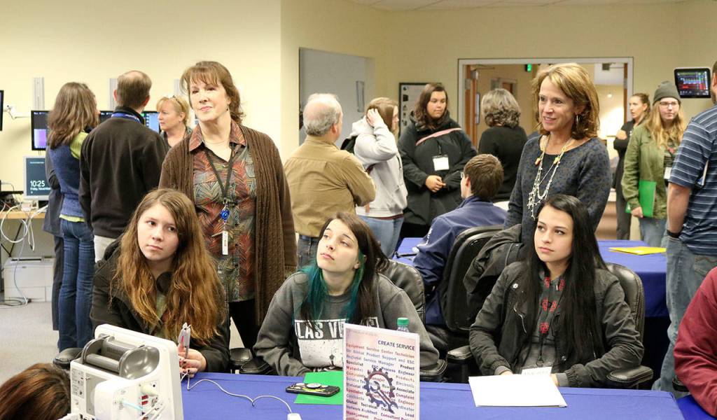 Two Rivers Students ask questions to Spacelabs Healthcare employees during a question and answer segment at the end of the tour. (Evan Pappas/Staff Photo)