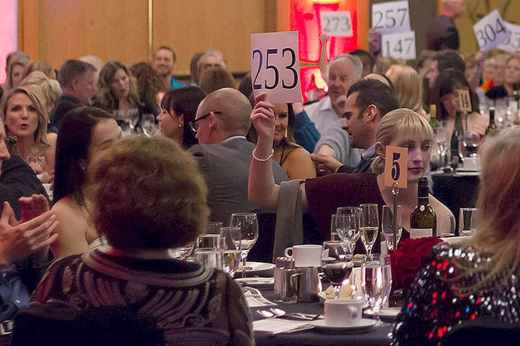 Guests bid on auction items at the Encompass gala. (Courtesy Photo)
