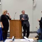A resident questions Washington State Patrol Captain Michael Dahl on the need for a weigh station right outside North Bend at a town hall meeting on the issue Nov. 7, while City Administrator Londi Lindell and Mayor Ken Hearing listen. (Carol Ladwig/Staff Photo)