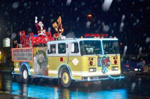 File photo                                An Eastside Fire and Rescue engine all lit up and bringing Santa into North Bend.