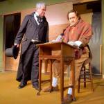 Scrooge, played by Tim Platt, reprimanding Bob Cratchit, played by Michael Murdock, when he asked for Christmas day off. (Courtesy Photo)