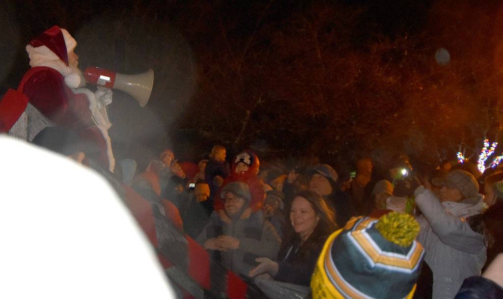 Using a bullhorn to be heard over his adoring fans, Santa Claus led the countdown to the citys official tree lighting. (Carol Ladwig/Staff Photo)                                Using a bullhorn to be heard over his adoring fans, Santa Claus led the countdown to the citys official tree lighting. (Carol Ladwig/Staff Photo)