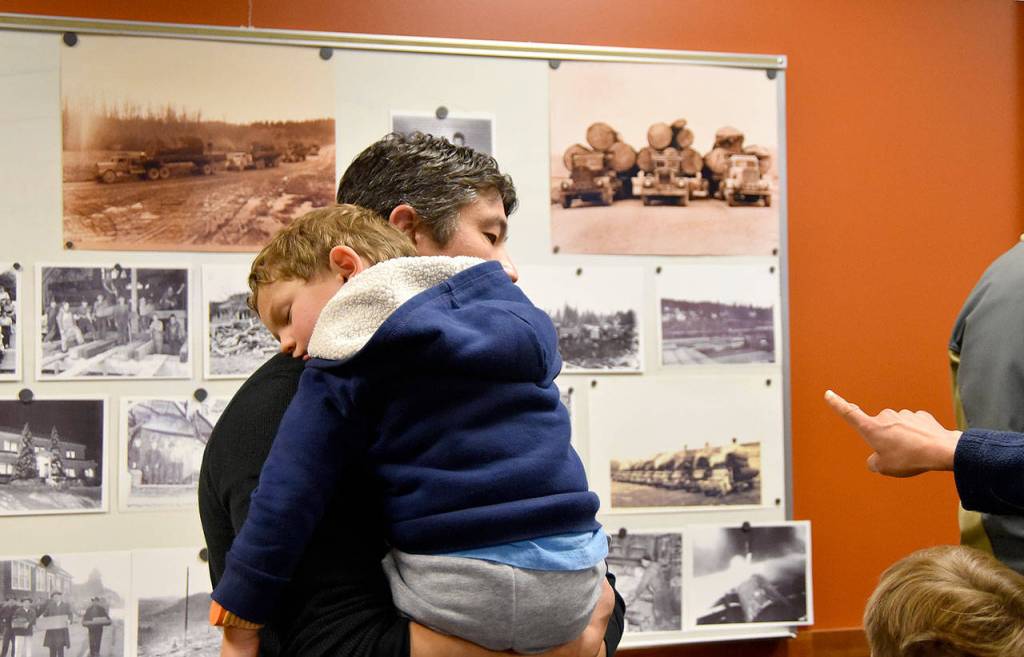 Carol Ladwig/Staff Photo                                Owen Anderson, age 3, was napping on his dad, Caseys shoulder, by the end of the event.