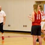 Coach Jason Marr dribbles the ball as he sets up a drill for the team to practice. (Carol Ladwig/Staff Photo)