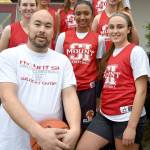Members of the Mount Si High School varsity girls basketball team finished practice Saturday with a photo with their new coach. Pictured from left are: front - Head Coach Jason Marr and Izzy Smith; middle - Lauren Wilbourne, Nitika Kumar, and Joelle Buck; back - Aliea Bliven, Jenae Usselman and Selah Heide. Sam Smith is missing. (Carol Ladwig/Staff Photo)