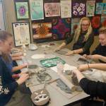 Mount Si High Schools cheer team works on making bowls for the Empty Bowls fundraising event, Dec. 8. (Courtesy Photo)