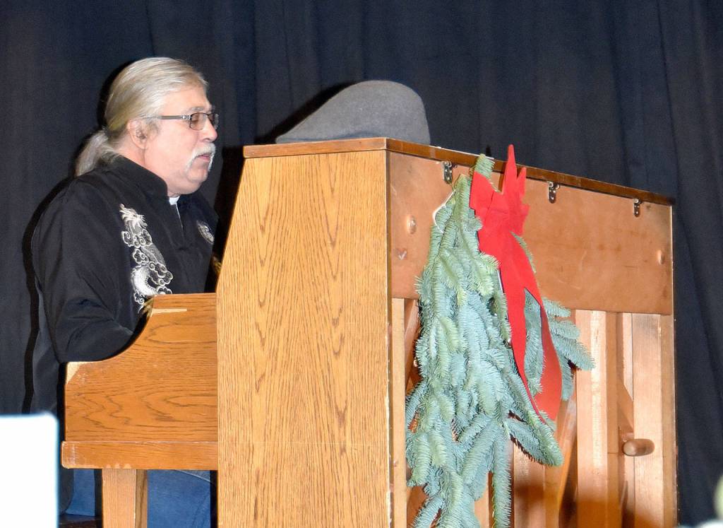 Johann Sasynuik provided holiday piano music during the Fall City holiday market. (Carol Ladwig/Staff Photo)