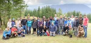Some 60 community volunteers helping to remove invasive plants and plant native species at Snoqualmie Point Park and the Meadowbrook Slough at the citys first ever Green Snoqualmie Day, Oct. 7, take a break for a group photo. (Photo courtesy of Jim Avery)