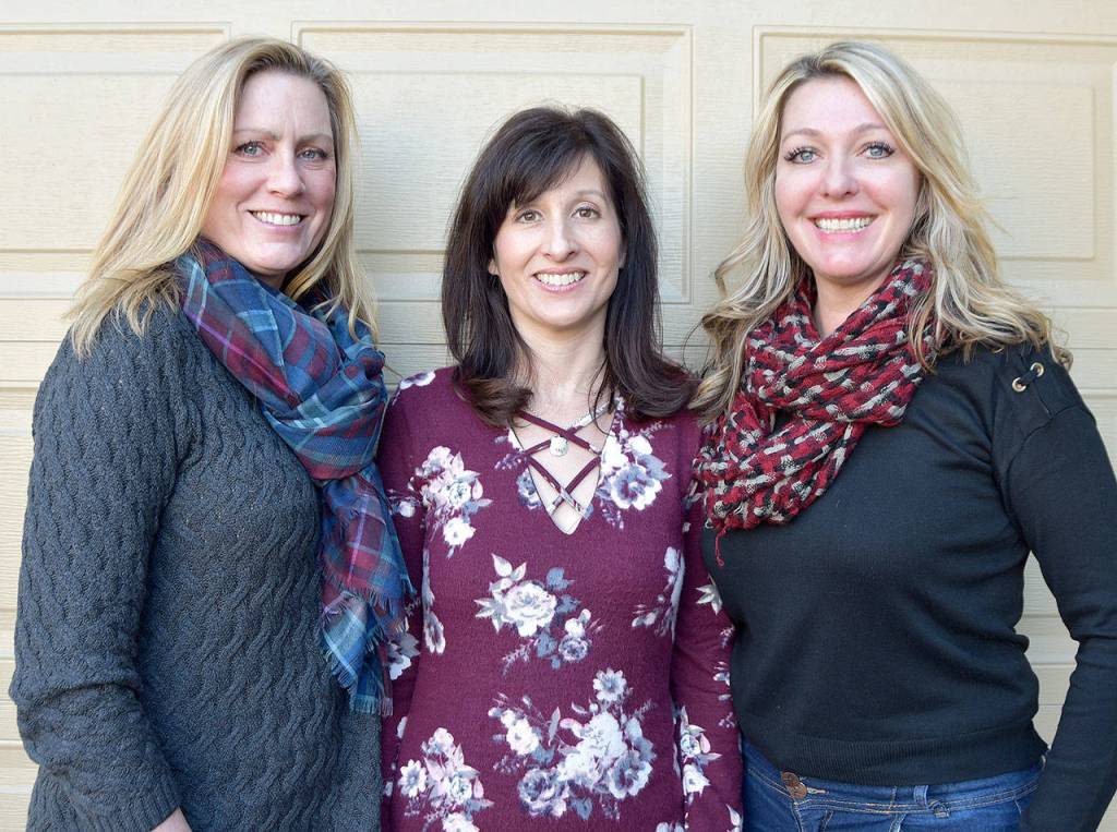 Now volunteers, these ladies will become official staff of the Trail Youth with receipt of a three-year, $400,000 Best Starts for Kids grant from King County. From left are Wendy Laxton, operations manager, Kristen Zuray, executive director, and Tonya Guinn, program director. (Carol Ladwig/Staff Photo)
