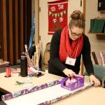Jen Stokes volunteered as a gift wrapper on the first Giving Tree shopping day. (Evan Pappas/Staff Photo)