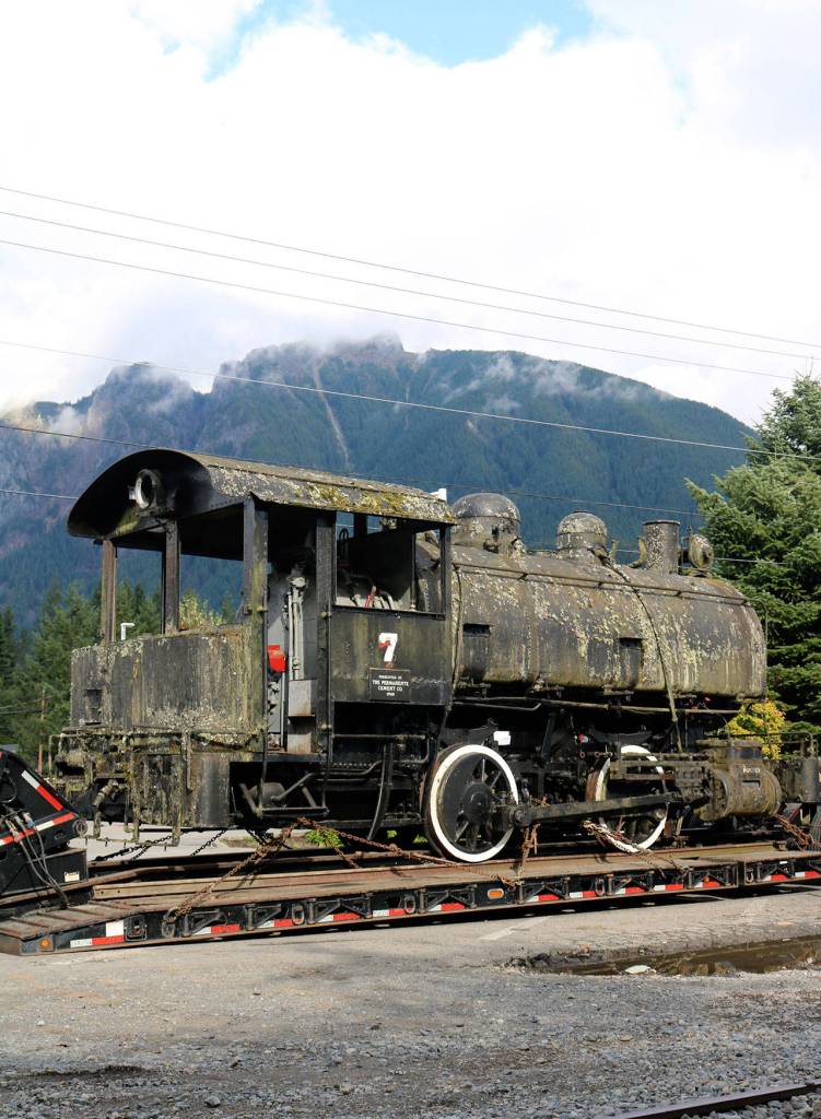The No. 7 Porter steam locomotive, acquired by the Northwest Railway Museum this summer, arrives at the North Bend depot as volunteers prepare to get it off of the truck and on to the rails. (Evan Pappas/Staff Photo)