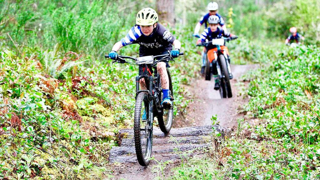 Mount Si Mt. Bike club member Grant Harrison races ahead of Lorenzo Harteveldt in the sixth grade race near Gig Harbor. The team has finished a successful season and grown from its 2012 start into a nonprofit that races most of the year now. (Courtesy Photo)