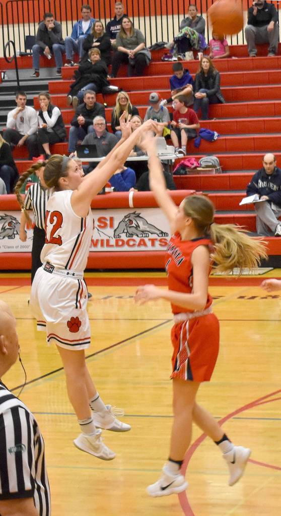 Mount Si High School girls basketball team co-captain Sam Smith shoots from the three-point line in the teams Dec. 20 match with Juanita. Mount Si won the game 46-36. (Photo courtesy of Charles Samuelson)