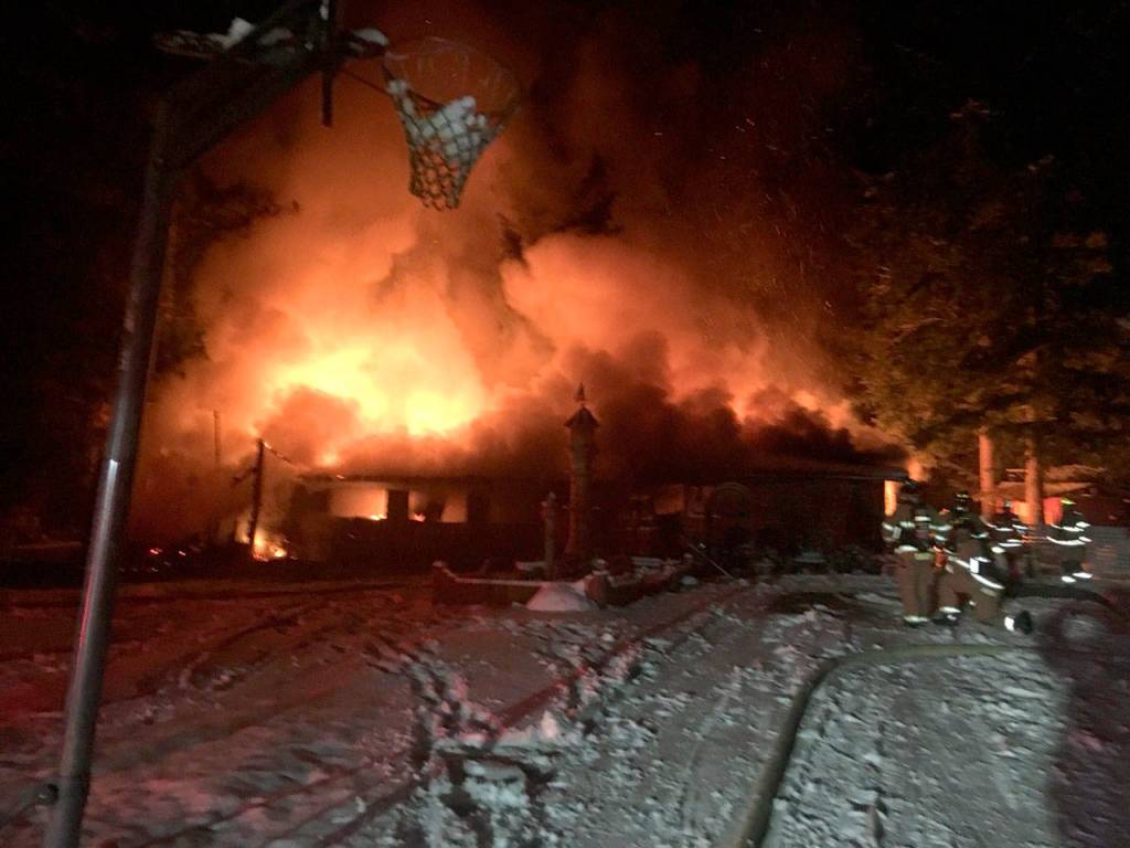 Firefighters work to stop a fire on NE 45th Street in Carnation on Monday, Dec. 15. (Photo courtesy of Eastside Fire and Rescue)