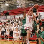 Jabe Mullins tries to take a shot while Woodinville players attempt to stop him. (Evan Pappas/Staff Photo)