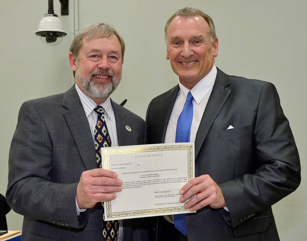 Ross Loudenback, right, was administered the oath of office by Mayor Ken Hearing at the start of the Jan. 16 North Bend City Council meeting. He was re-elected to his seat in November. (Courtesy Photo)