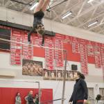Tylor Zwiefelhofer attempts her new routine at the Eastlake match as coach Kelly Loragner watches from below. (Evan Pappas/Staff Photo)