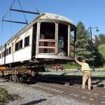 Almost there! With the car generally lined up with the flatbed, volunteers then began the work of adding supports to hold the car steady for its next move, down the tracks. (Carol Ladwig/Staff Photo)