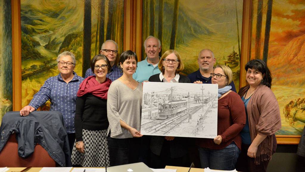 The Landmark Commission gathers after approving the designation of car 523. From left, back row: Dave Battey, David Pilgrim, Todd Scott. Front row: Ella Moore, Jennifer Meisner, Caroline LeMay, Loralea Hudson, Poppi Handy, Rebecca Ossa. (Courtesy Photo)